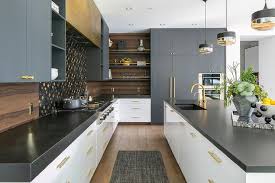 The sleek cabinet pull design lines are embellished with straight, rectangular edges perfect for transforming your traditional or contemporary home. White Flat Front Drawers With Brass Pulls Topped With Thick Black Quartz Contemporary Kitchen