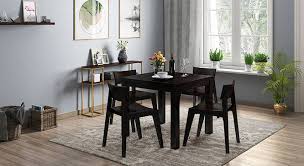 Beveled oval shape to make a welcoming kitchen space ambiance and finished in rich linen white, the kitchen table can be acquired with hardwood or padded seat chairs. Arabia Gordon 4 Seater Storage Dining Table Set Urban Ladder
