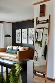Mirror Mirror In The Hall Or In The Living Room The Beau Mirror Is A In 2020 Black Accent Wall Living Room Accent Walls In Living Room Living Room Hardwood Floors
