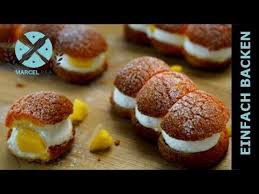 Gespickte Eclairs Gefullt Mit Mango Creme Und Knusprigem Uberzug Eclai Eclair Rezept Eclair Eclairs