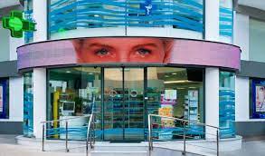 The Inspiration For This Innovative Design Of Mr Tomaras Pharmacy Came From Its Cylindrical Floor Plan The Central Spot Catche Pharmacy Design Pharmacy Design