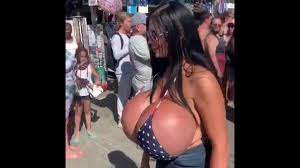 Woman with enormously oversized breasts turns heads at Venice Beach