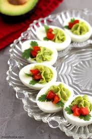 These holiday appetizer recipes and snacks are perfect for christmas and new year's eve parties. Christmas Deviled Eggs Devilled Eggs Recipe Best Holiday Appetizers Xmas Food