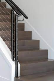 This Sleek Staircase Features Perfect 90 Degree Edges On The Beautifully Shined Wood Steps Steel Cable Ra Modern Staircase Home Stairs Design Staircase Design