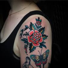 Traditional Style Rose And Butterfly Tattoo Inked On The Left Shoulder And Arm Rose And Butterfly Tattoo Traditional Rose Tattoos Rose Shoulder Tattoo