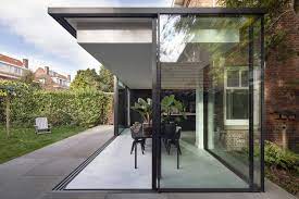 Ceilings are 11' throughout the home and every room has outdoor access through sliding doors.two bedrooms share a. Fig Tree House Glass Box Extension By Bloot Architecture