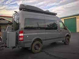 Vankerouac Ready To Hit The Road Again Roof Rack Lights Solar Antennas Awning Ski Box Rear Bumper With Moto Mount Van Life Sprinter Van Sprinter Camper
