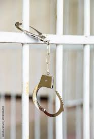 Metal handcuffs luxury with unlocking. Closeup Of Unlocked Handcuffs Hanging On Jail Bars Stock Photo Adobe Stock