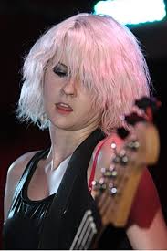 Near ten, singer/guitarist Billy Lunn walked onstage, shirtless,  "strawberry blonde" tattooed across