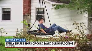 Man makes heroic rescue of boy swept away in Waverly flood