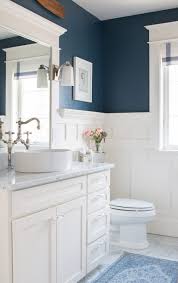 Navy Blue Walls With A White Vanity With Marble Counter And Floors Beach House Bathroom Blue White Bathrooms House Bathroom