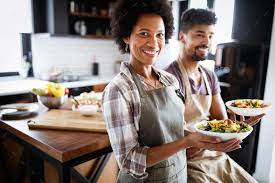 Beautiful Young Couple Cooking Healthy Food Together At Home Having Fun In The Kitchen Healthy Meals To Cook Healthy Cooking Couple Cooking