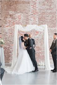A Modern Industrial Wedding In Downtown Fort Smith Ar By Arkansas Photographer Kim Chr In 2020 Exposed Brick Wedding Venue Modern Wedding Ceremony Brick Wedding Venue