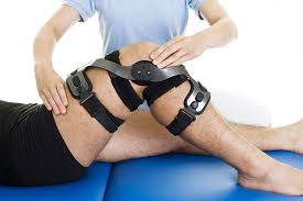 Physical therapy with knee brace after surgery, post-surgical rehabilitation