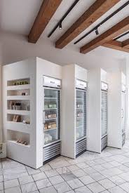 White Painted Ceiling Between Wooden Rafters Finishes Clean Lines Shop Interiors Supermarket Design Store Interiors