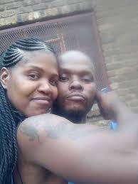 Can someone remove the guy in black holding a white flag?