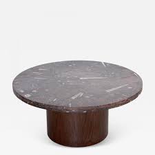 Rectangle coffee table featuring patterned ivory colored fossil stone veneer top and decorative metal base in a brown finish metal base features decorative x details brown metal finish with ivory color stone top assembly required dimensions: Heinz Lilienthal Heinz Lilienthal Coffee Table With Fossil Stone Top