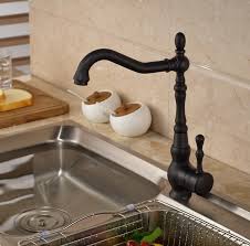 Single hole antique bronze finish bathroom sink faucet with bronze light fixtures and cabinet knobs. Juno Classic Deck Mount Single Handle Rotation Blackened Bronze Kitchen Sink Faucet