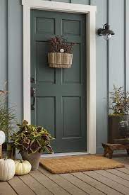 I want to repaint my front door to cover up some old water stains and add curb appeal. These Vibrant Front Door Colors Will Give Your Home A Pop Exterior House Colors Exterior Door Colors Painted Front Doors