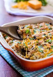 Corn, tomatoes, and black beans are baked with cream cheese and cheddar cheese for a creamy, quick, and easy side dish. Skinny Mexican Chicken Quinoa Casserole A Healthy Easy Casserole Recipe That Your Entire Family Will Easy Casserole Recipes Mexican Food Recipes Food Recipes
