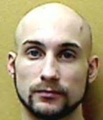 Man serving life takes plea in assault charge