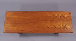 Circular top supported by stylish bade, all in solid teak. Danish Teak Coffee Table Modulolab