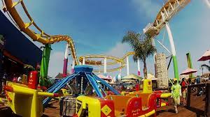 Amusement Park Worker With Roller Coaster In Background Stock Footage By Videopro2go Amusement Park Roller Coaster Stock Video