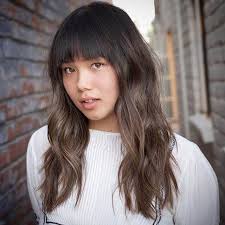 This long haircut with bangs is effortless and cute, and the layers will continue to grow out nicely. 50 Fun Fresh Ways To Style Long Hair With Bangs For 2020