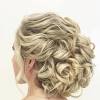 Sweep your hair back and pin it into a simple and elegant low chignon. 3