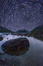 Star Trails Over Jordan Pond Is A Photograph By Jesse Macdonald Stars Soar Through The Night Sky Over Jordan Pond Illuminating The Water And Mountains Below