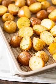Simple Oven Roasted Potatoes Made With Garlic And Parsley Make An Easy And Delicious Si Potato Recipes Side Dishes Golden Potato Recipes Roasted Potato Recipes