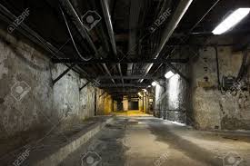 A basement or cellar is one or more floors of a building that are completely or partly below the ground floor. Inside An Old Industrial Building Basement With Little Light Stock Photo Picture And Royalty Free Image Image 29715870