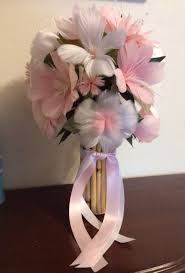 This beautiful flower is an elegant option for a bouquet and boasts an appealing fragrance. True Love Never Dies So Why Should Your Flowers I Hand Make Real Bird Feather Flowers Contact Me To H Feather Bouquet Wedding Feather Wedding Feather Flower