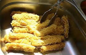 The roti jala is a pretty dish that looks like a lace doily due to the way it is made. Roti Jala Wikiwand