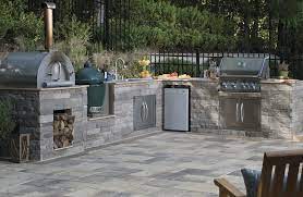 This grill makes cooking with charcoal almost as easy as cooking with gas. Find Out What S Cooking In The Latest Outdoor Kitchen Design Trends Built In Outdoor Grill Outdoor Kitchen Design Modern Outdoor Kitchen