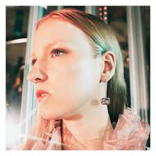 Inside the celebration of the Gucci Gift campaign, a close up of the new  silver Gucci Jewelry earrings featuring a cube pendant enriched with an  intricately detailed pattern and the Square G—an