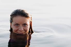 Woman Sticking Half of Her Face Out of Body of Water · Free Stock Photo