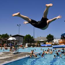 Swimmers flock to city pools to beat the heat with free-pass program