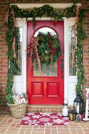 An Old Fashioned Christmas Front Porch With Flannel And Greenery The Everyday Home Www Everydayhomeblog Com Christmas Porch Decor Front Porch Christmas Decor Christmas Front Doors