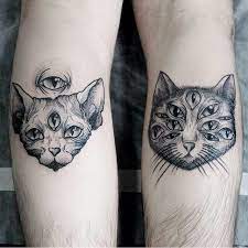 This surreal tattoo depicts a cat with four eyes on the wearer's left thigh. Pin On Tattoos