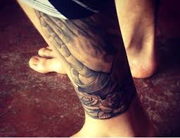 Very often we can see the names of lovers or hearts combined with praying hands in praying hands tattoo designs. Justin Bieber Gets New Praying Hands Rose Tattoo By Her Own Rules