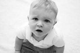 Baby Boy with a sad face stock image. Image of pout, white