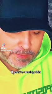 Middle Aged Guy with Blue Eyes That Winks