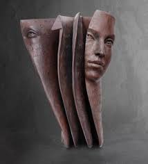 Faces, in every pose, peering out of bronze paper book sculptures by Paola  Grizi ❤️