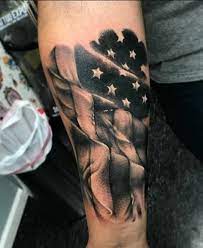 He has a large assortment of tattoos, including a tribal tattoo on his chin, an assortment of mayan/aztec tattoos on his chest and left arm, the devildriver logo on his upper arm and face, and the coal chamber logo on his forearm. American Flag Tattoo American Flag Forearm Tattoo Tattoos For Guys Forearm Tattoo Men