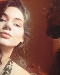 Millie and I hanging out during quarantine last year. My what a strange cat  you've grown into. 🐈‍⬛ Note to self not to adopt a feral rescue kitten  during a pandemic again