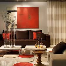 Chocolate brown and orange colors are excellent color combinations for making your home interiors feel warm and cozy, energetic and optimistic. Pin By Ayesha Kashif On Home Living Room Orange Living Room Red Living Room Colors
