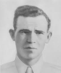 Gunner Kenneth Bratton, wounded in the knee by shrapnel, being pulled out  of the turret of a TBF Avenger aircraft aboard USS Saratoga after a  successful raid