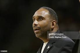 Head coach Dru Joyce of St. Vincent-St. Mary High School concentrates...  News Photo