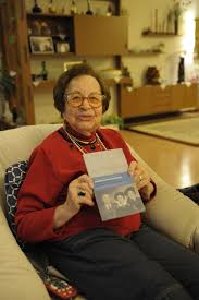 Ruth Zimmermann holds her first published memoirs in her hand